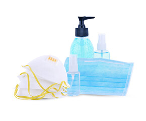 Surgical medical face mask, bottles of antiseptic hand gel and spray on white background.