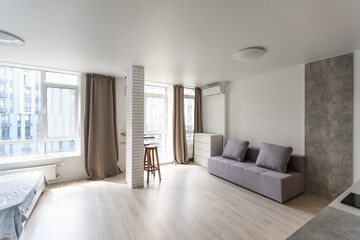 Interior of small modern apartment with white wall