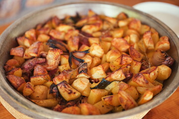 Closeup of baked potatoes with vegetables