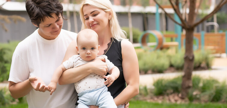 Lesbian Interracial Family. Two Moms With Their Baby. Unconventional Family