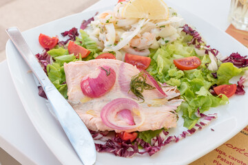 Seafood salad with salmon and vegetables