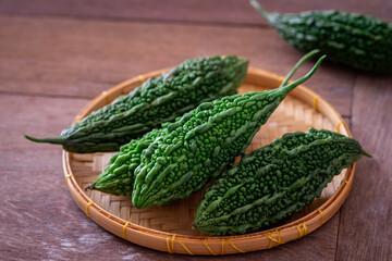 Bitter gourd or bitter melon on wicker basket