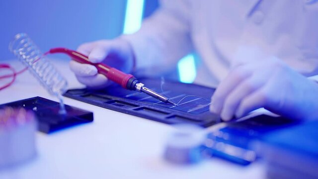 Apply solder to solar cell close-up 4K