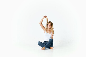 woman sitting on the floor posing fashionable hairstyle glamor