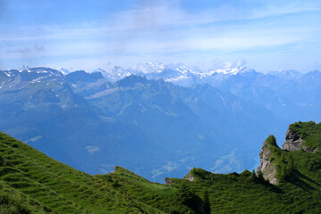Panoramic view of Swiss alps at Bernese Highland on a beautiful sunny summer day seen from Brienzer Rothorn. Photo taken July 21st, Flühli, Switzerland.