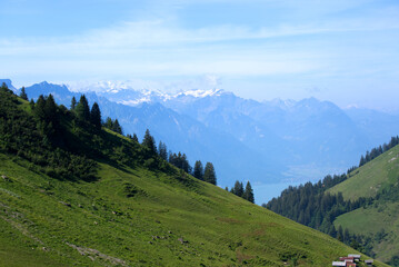 Fototapeta na wymiar Panoramic view of Swiss alps at Bernese Highland on a beautiful sunny summer day seen from Brienzer Rothorn. Photo taken July 21st, Flühli, Switzerland.