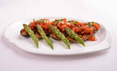 baked bbq eggplant with chef homemade salsa sauce and asparagus in white background for Christmas festival menu