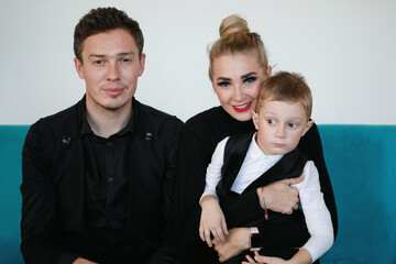 Family of three portrait inside