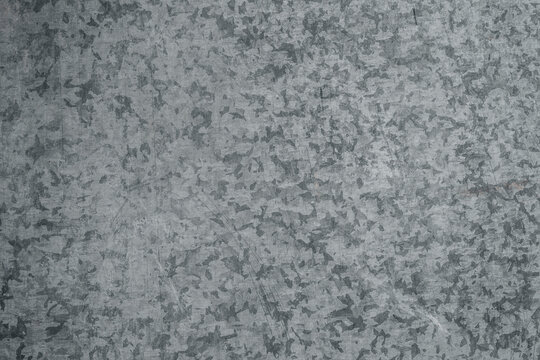 Background texture of a raw galvanised metal sheet