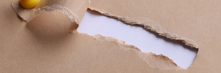 Inscription search in hole on white paper with ragged edges