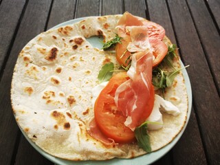 slice  od piadina romagnola  with   mozzarella 