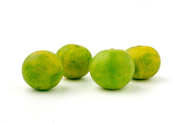 Group of Green lemon placed arrange isolated on a white background. lemon peel is rough.