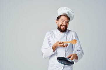 professional chef Frying pan in hand cooking cooking work
