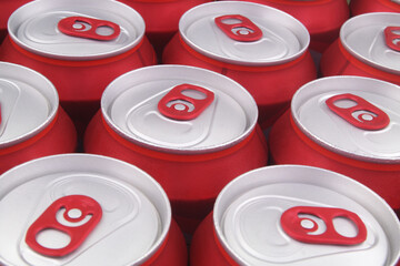 Many red tin cans close up. Beer or soft drink cans background.