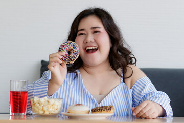 Happiness closeup shot of Asian young happy beautiful hungry overweight fat chubby female smile ...