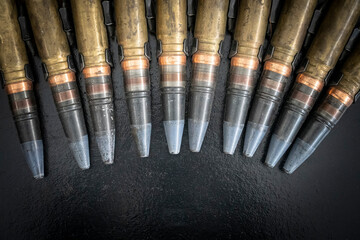 bullets for an artillery machine gun. Weapons cartridges machine gun belt large caliber.