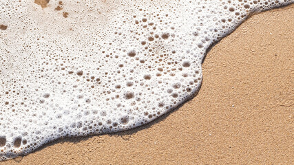 Beach sand and sea waves background. Travel and holiday concept