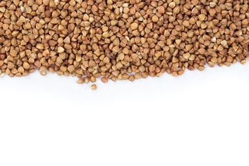 Buckwheat on white background. Top view. Buckwheat. Stockpiling. Buckwheat grains. Grain culture. Pandemic.