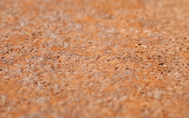 Macro photo of rusty metal surface, rough old texture background. Selective focus in the middle of the frame.