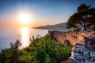 Fototapeta na wymiar Beautiful Castle on the hill in Alanya at sunset. Turkey