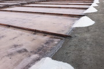 Sea salt in evaporation pools with pastel shades.