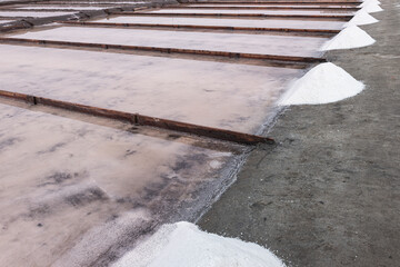 Sea salt in evaporation pools with pastel shades.