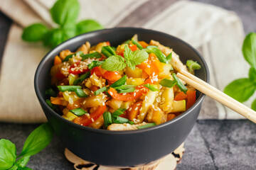 Turkey with vegetables. Delicious hot dish on a concrete table. Turkey with vegetables in a plate