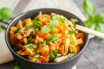 Turkey with vegetables. Delicious hot dish on a concrete table. Turkey with vegetables in a plate