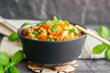 Turkey with vegetables. Delicious hot dish on a concrete table. Turkey with vegetables in a plate