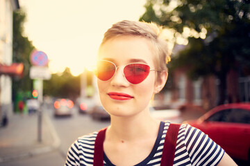 pretty woman in fashionable glasses outdoors sun walk summer