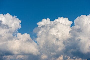 Fototapeta na wymiar Beautiful storm clouds, cumulus clouds or cumulonimbus against a clear blue sky. Photography, Full frame.