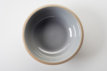 Round shaped ceramic bowl on white background