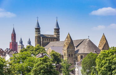 Fototapeta na wymiar Towers of historic churches in the skyline of Maastricht, Netherlands