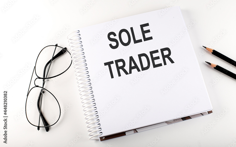 Poster notebook with text sole trader on the white background