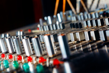 Analog mixing console . Retro musical studio . Faders and buttons