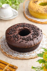 A chiffon cake is a very light cake made with vegetable oil, eggs, sugar, flour, baking powder, and flavorings. 
Chiffon cake with characteristic hole in the center from an ungreased tube pan. 