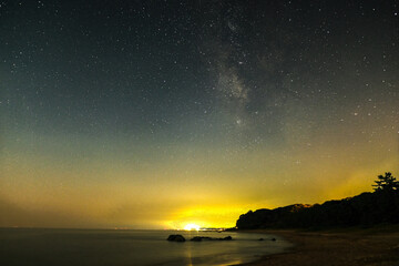 sky and milkyway over the beach in Japan