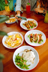 Food Table. Friendly dinner in a cafe.People, lifestyle, lunch, party, relax concept.