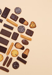 Chocolate cookies mix background. Sweets choco lover design. Minimal art. Holidays  time, winter christmas celebration wallpaper