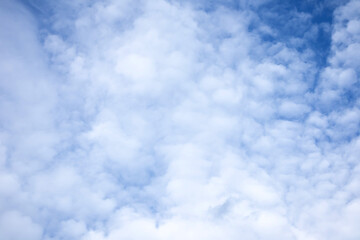 White clouds are in blue sky at daytime, natural panoramic background photo.