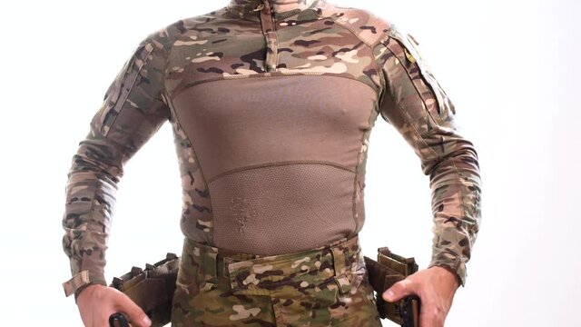 Special Forces soldier in multicam camouflage wears a combat belt with pouches on a white background. 