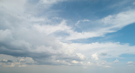 Obraz premium Grey color clouds come to blue sky
