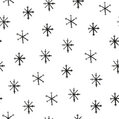 Seamless pattern with hand drawn snowflakes.