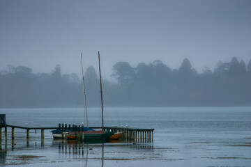 Sail boats moored at Lake Wendouree jetty on a cold misty morning