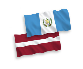 Flags of Latvia and Republic of Guatemala on a white background
