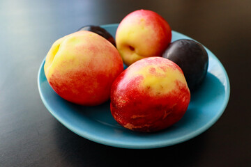 bowl with nectarine and plums