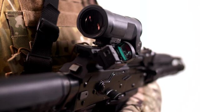 Modern high-precision optical and collimator sighting system with variable magnification on the assault rifle. Close-up. White background 