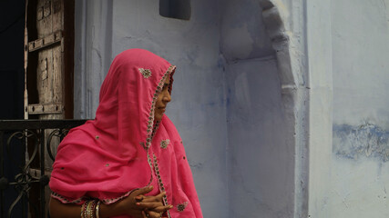 Closeup shot of a young female dressed in a pink sari