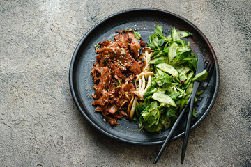 Stir-fried vegan meat, soy protein with green salad, copy space