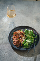Stir-fried vegan meat, soy protein with green salad, copy space